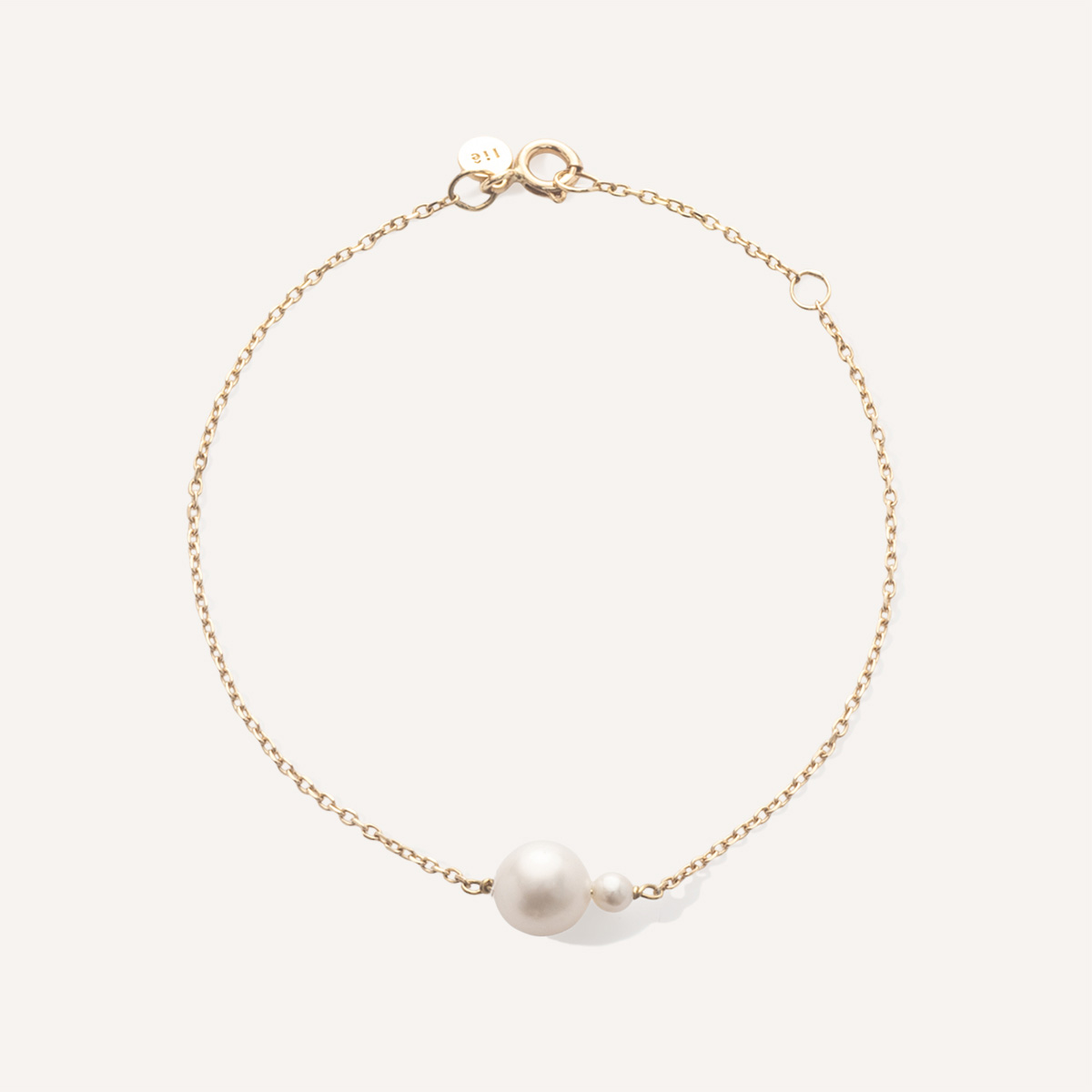 pulseira em ouro 18k com duas pérolas