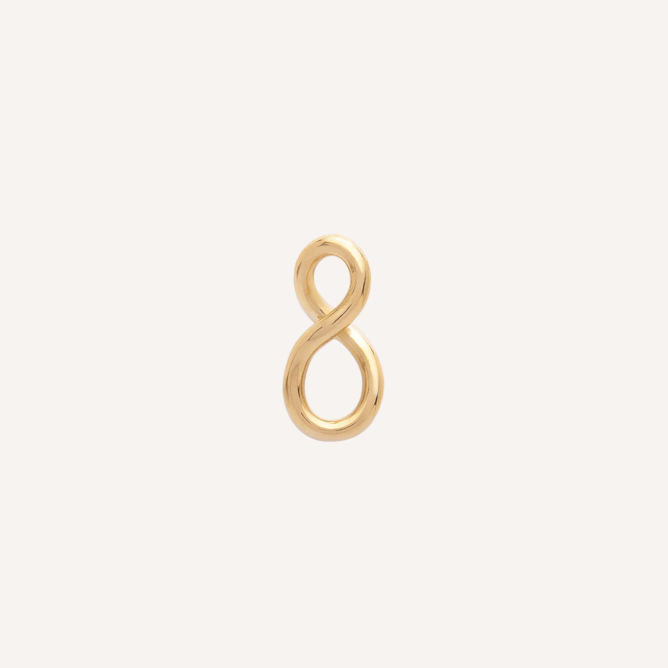 pingente infinito em ouro amarelo sobre fundo branco